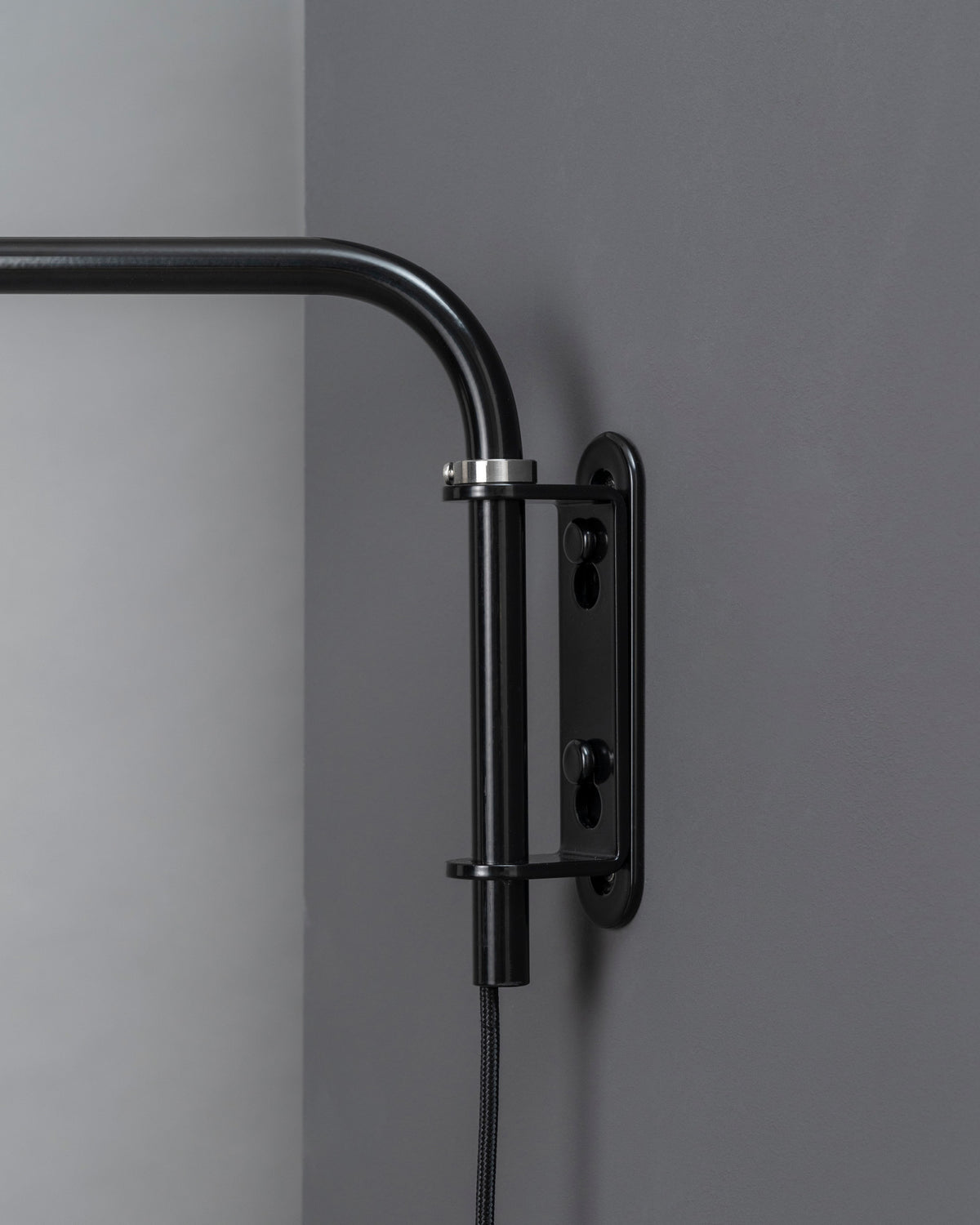 K830 wall by Midgard showing the rotating tubular steel arm and wall mounting construction