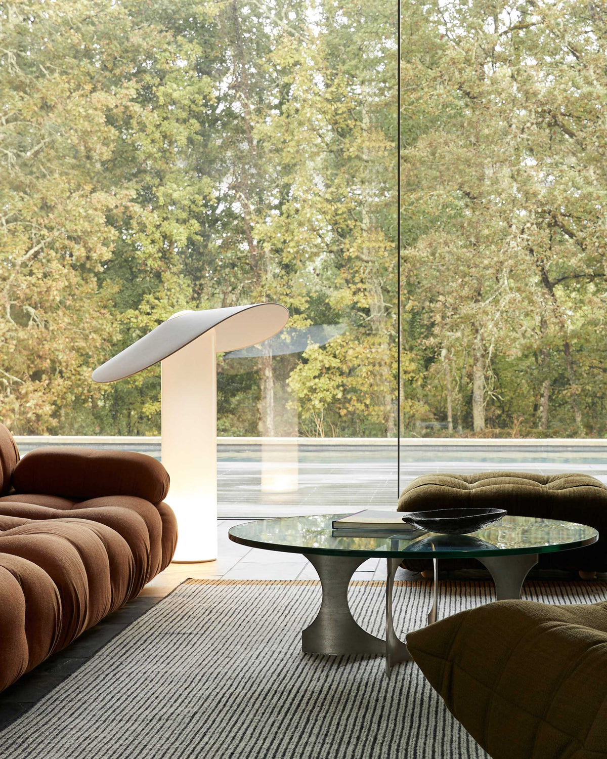 LOJA table lamp designed by Sebastian Herkner for Midgard in a contemporary interior with atmospheric Tunable White LED lighting.