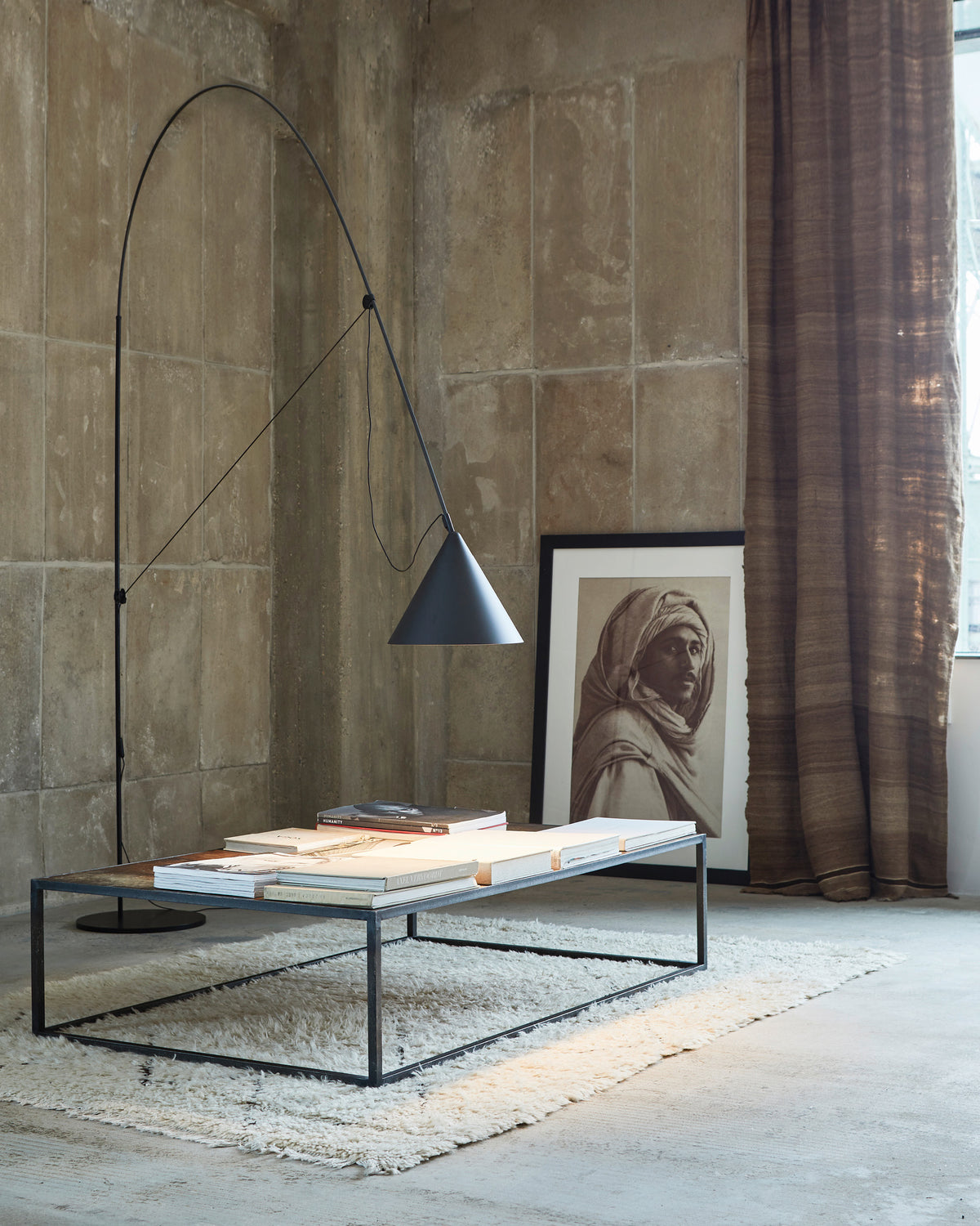 Midgard AYNO XL adjustable floor lamp in black in a modern living room interior