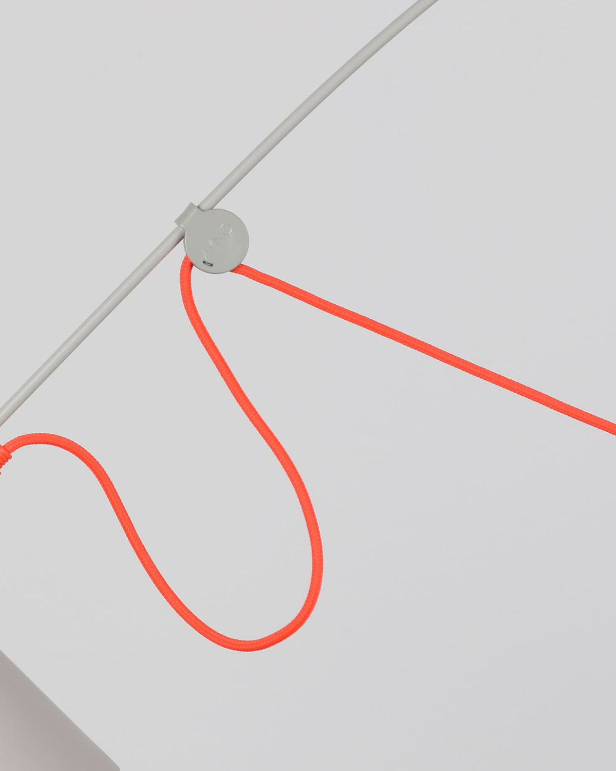 Midgard AYNO XL adjustable wall lamp in silk grey, detail with neon orange textile cable