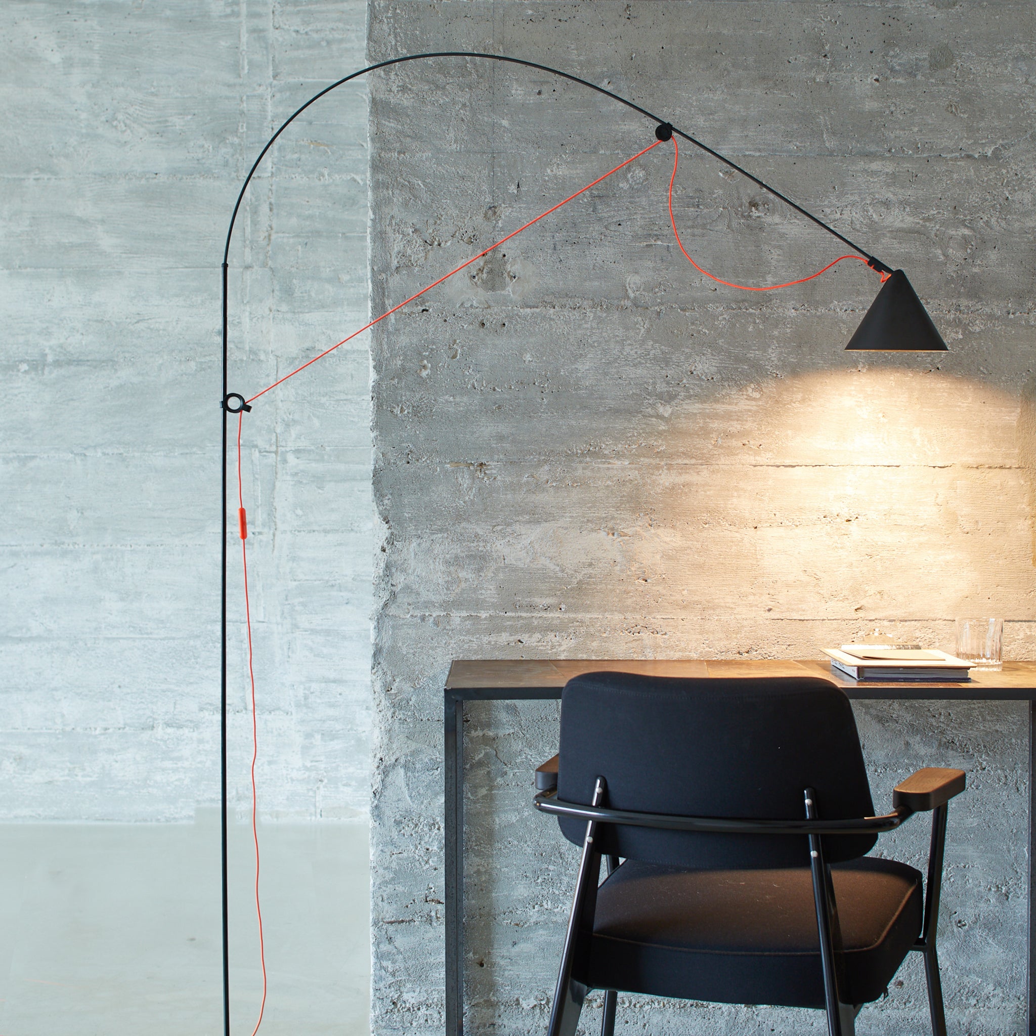 Minimalist AYNO black floor lamp with flexible arm, perfect for modern living rooms, by Midgard Licht and designer Stefan Diez