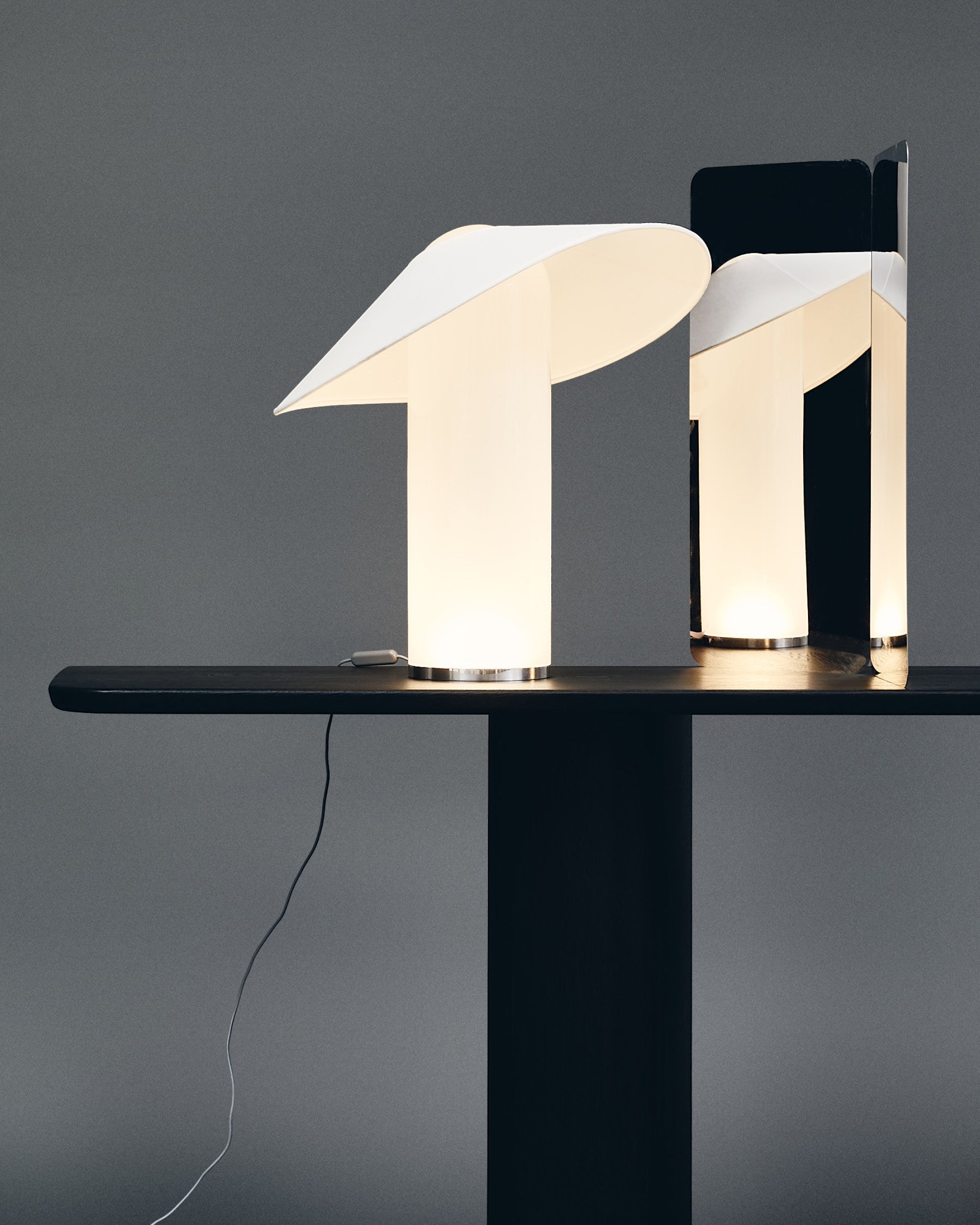 LOJA table lamps designed by Sebastian Herkner for Midgard, shown together with their sculptural curved paper shades.