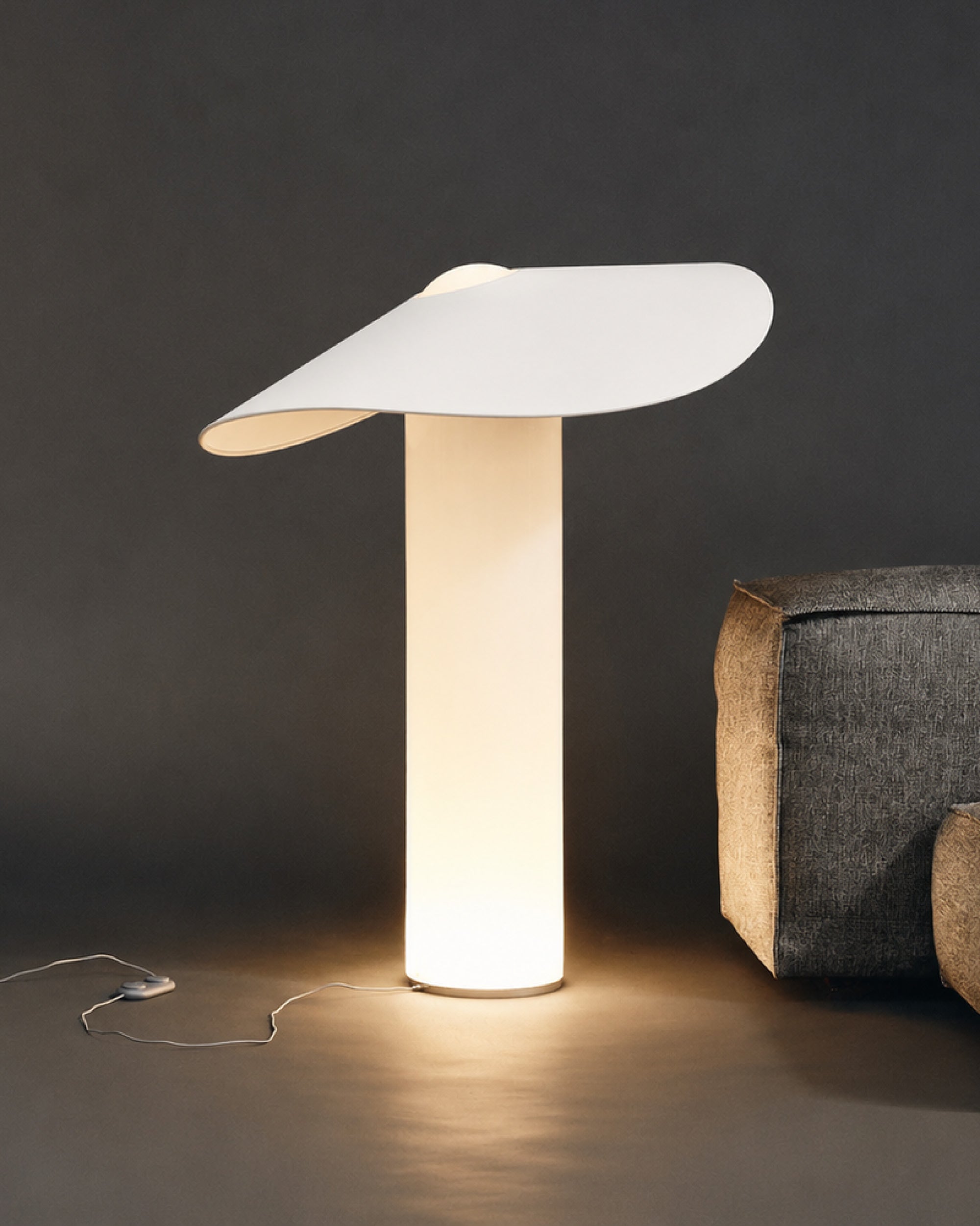 Illuminated LOJA table lamp by Sebastian Herkner for Midgard, with hand-blown glass body and curved paper shade.