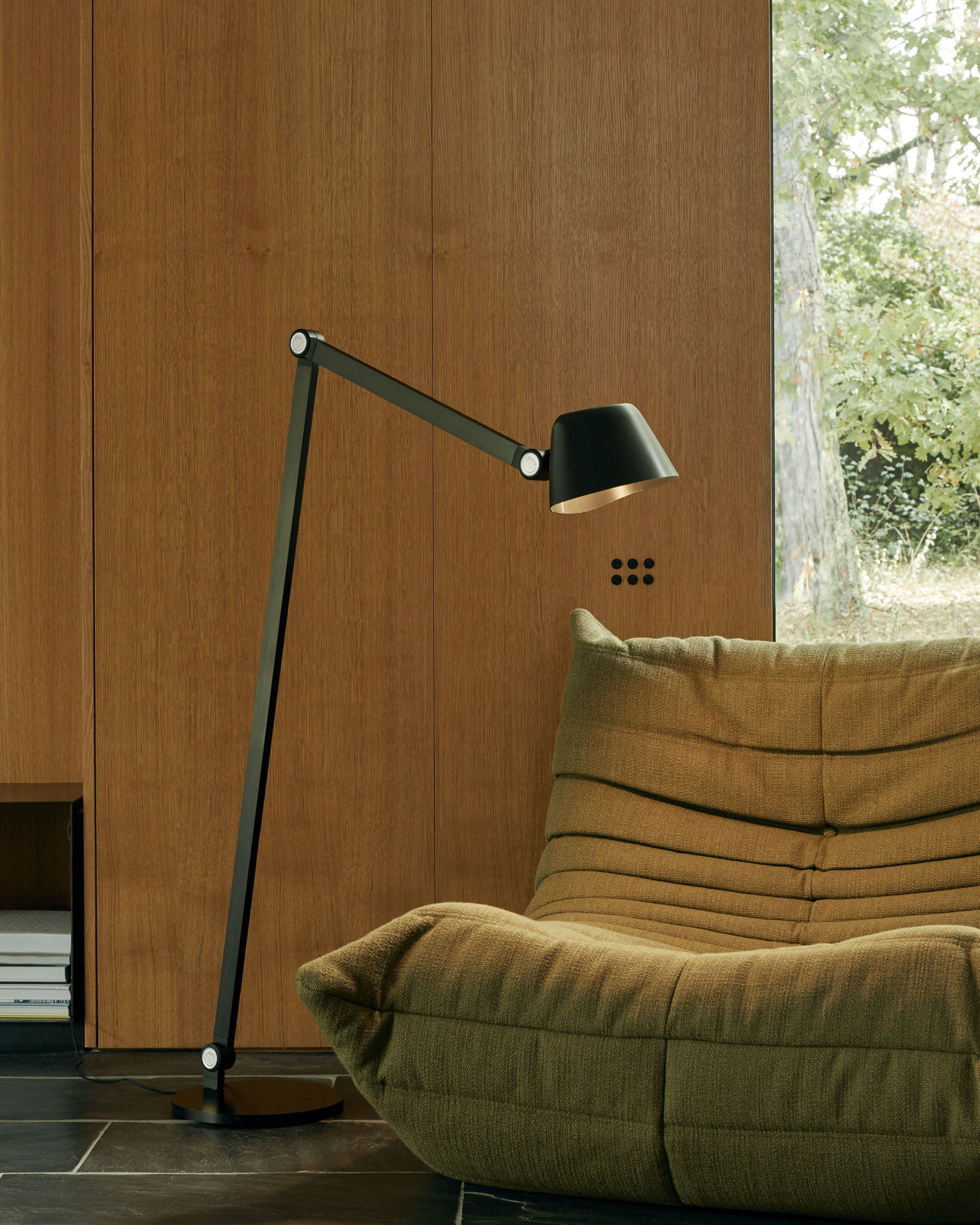 Midgard Modular NEO Bauhaus LED floor lamp providing directional light in a living interior