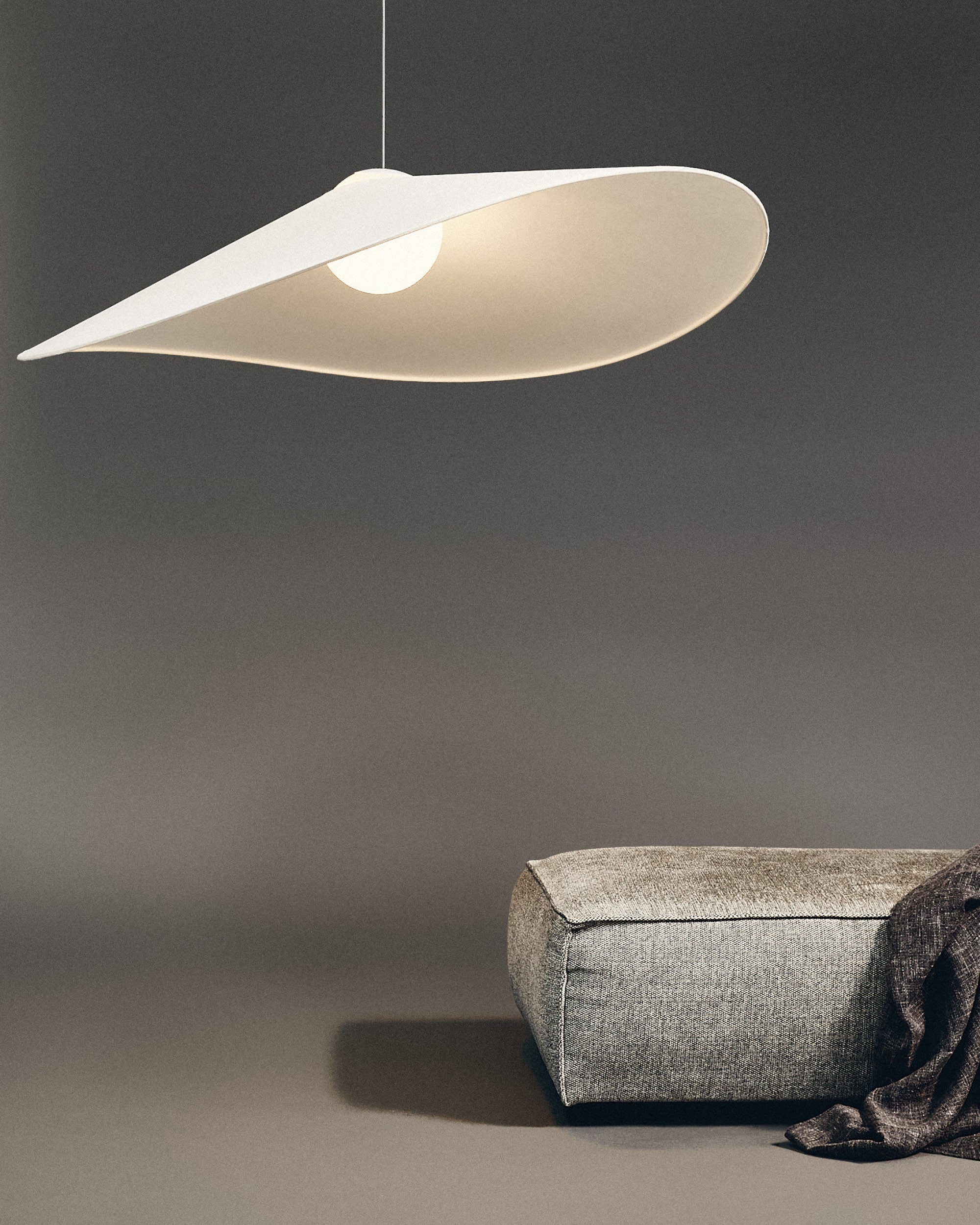 LOJA pendant lamp by Sebastian Herkner for Midgard, providing direct and indirect Tunable White LED light above a seating area.