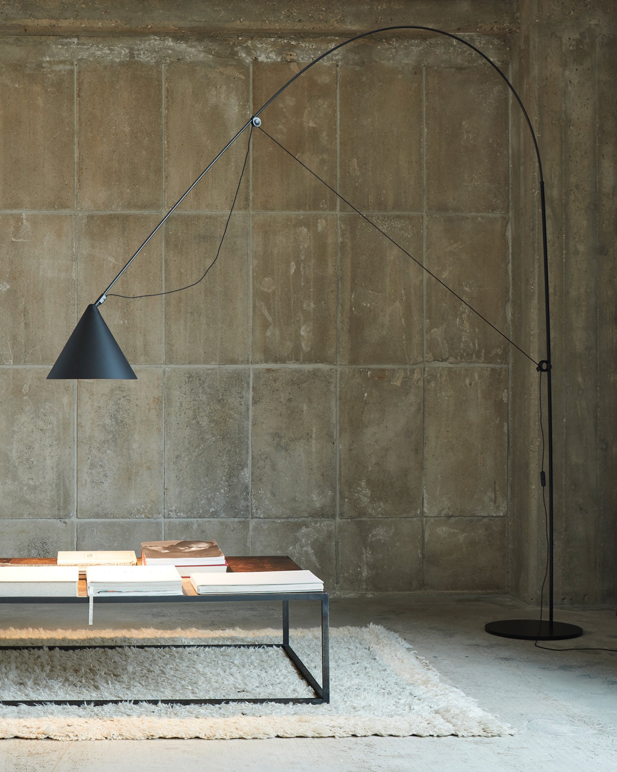 Midgard AYNO XL adjustable floor lamp in black in a modern lounge interior