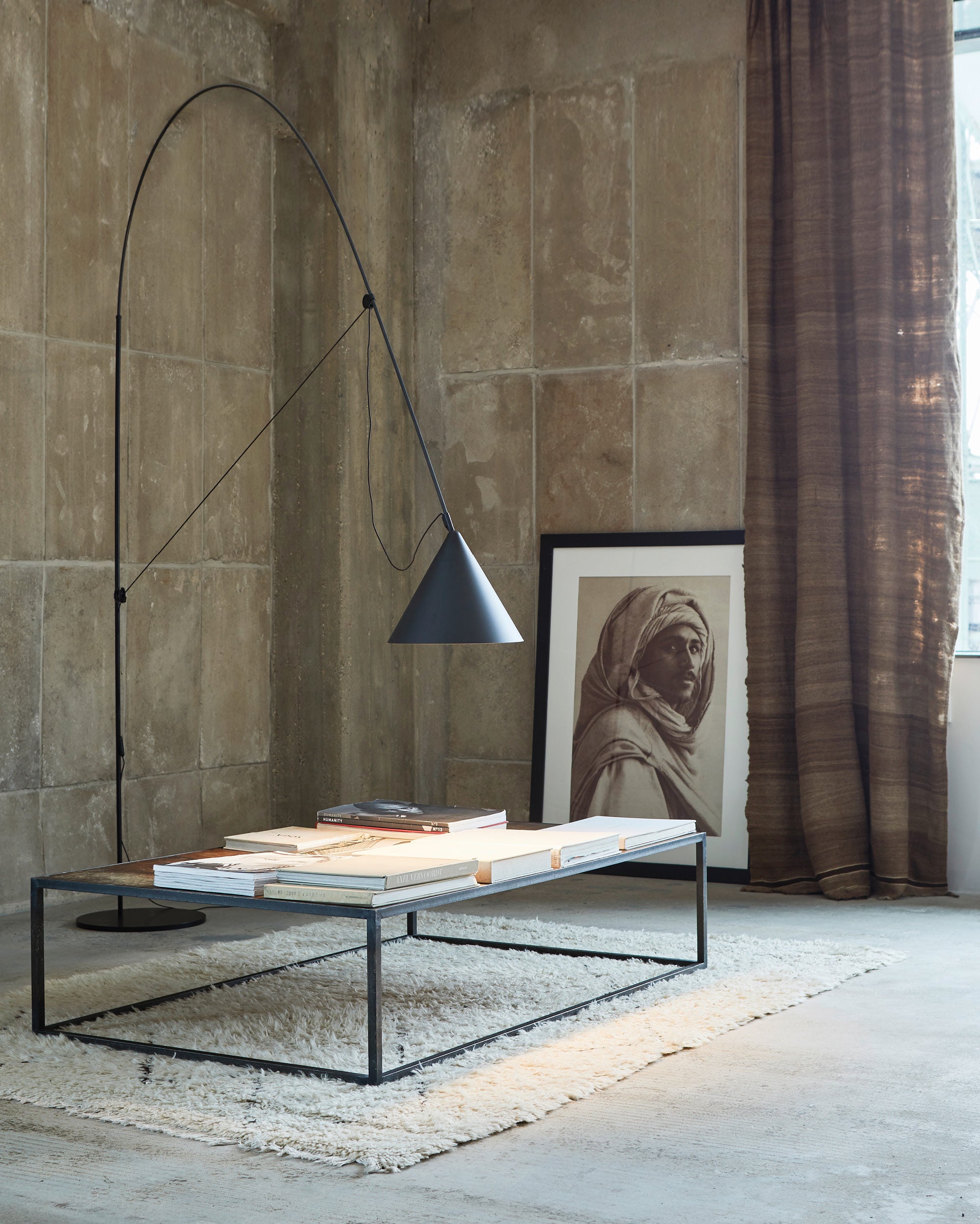 Midgard AYNO XL adjustable floor lamp in black in a modern living room interior