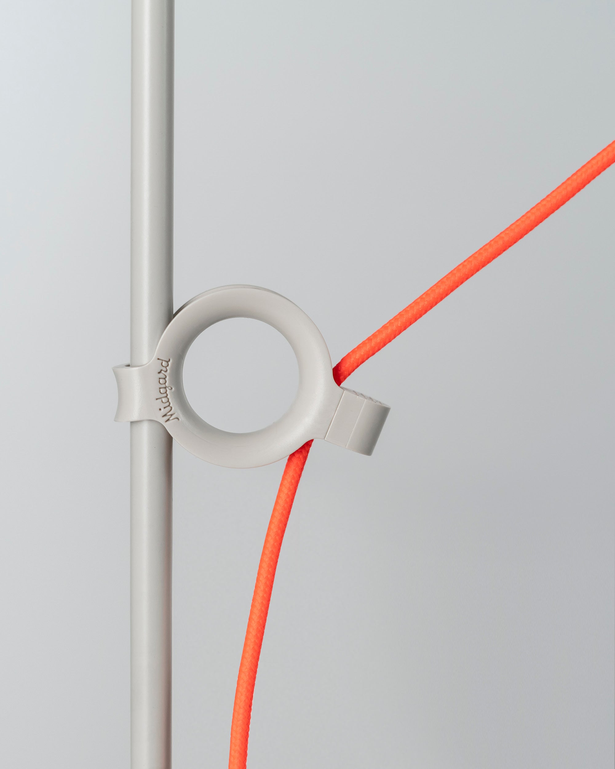 Patented adjustment ring of the Midgard AYNO XL adjustable floor lamp in silk grey with neon orange textile cable