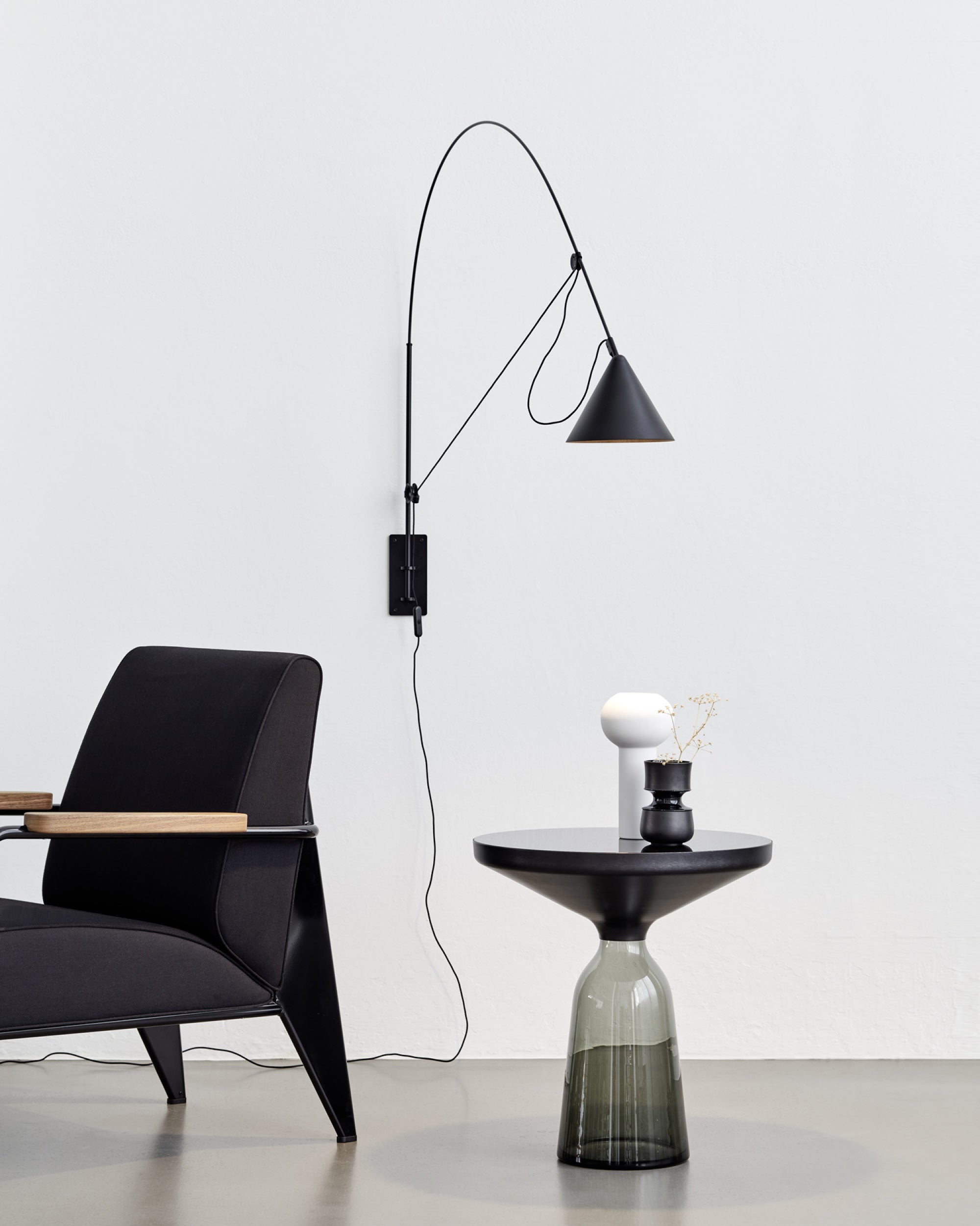 Midgard AYNO L adjustable wall lamp in black in a modern lounge interior