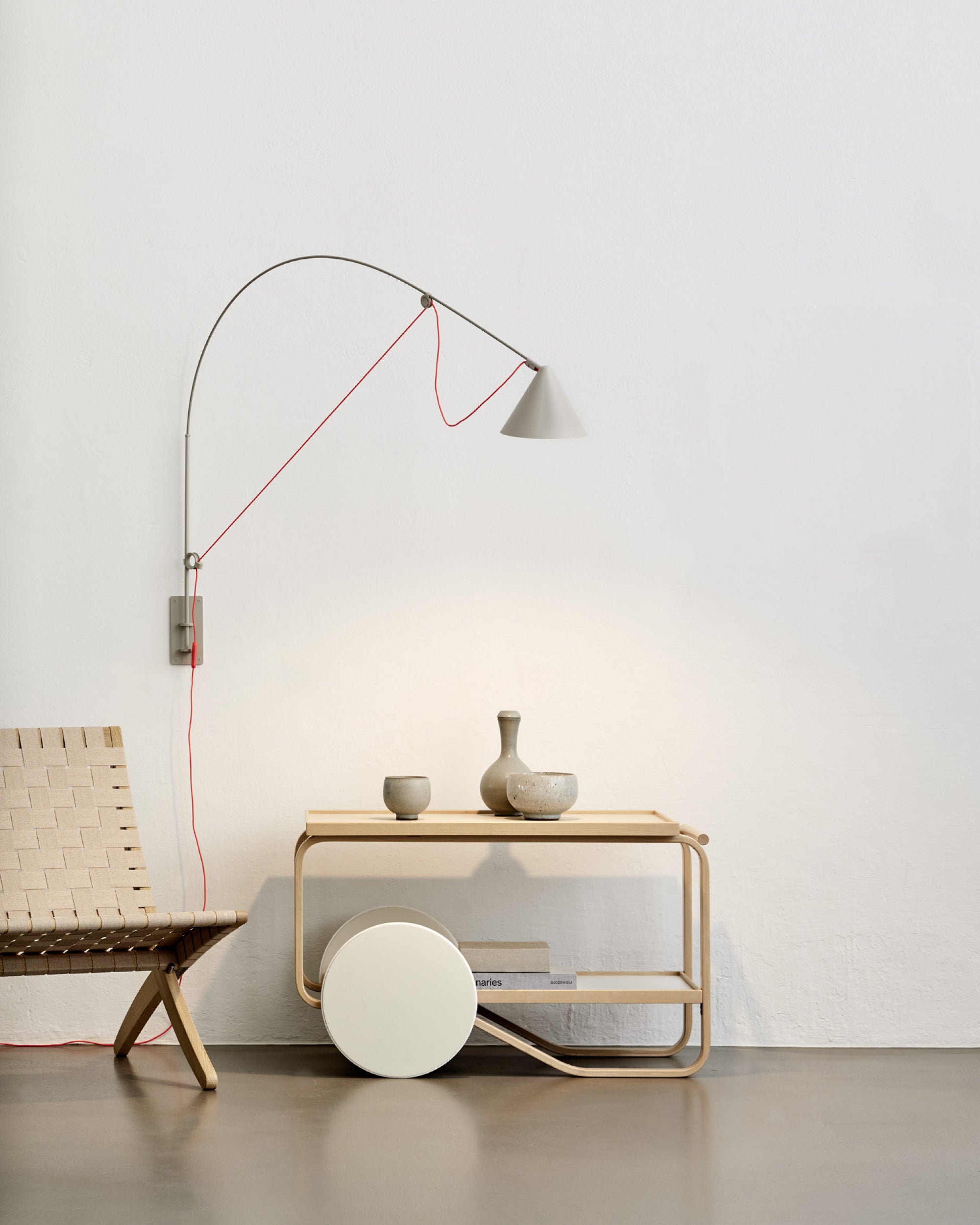 Midgard AYNO L adjustable wall lamp in silk grey in a modern living interior