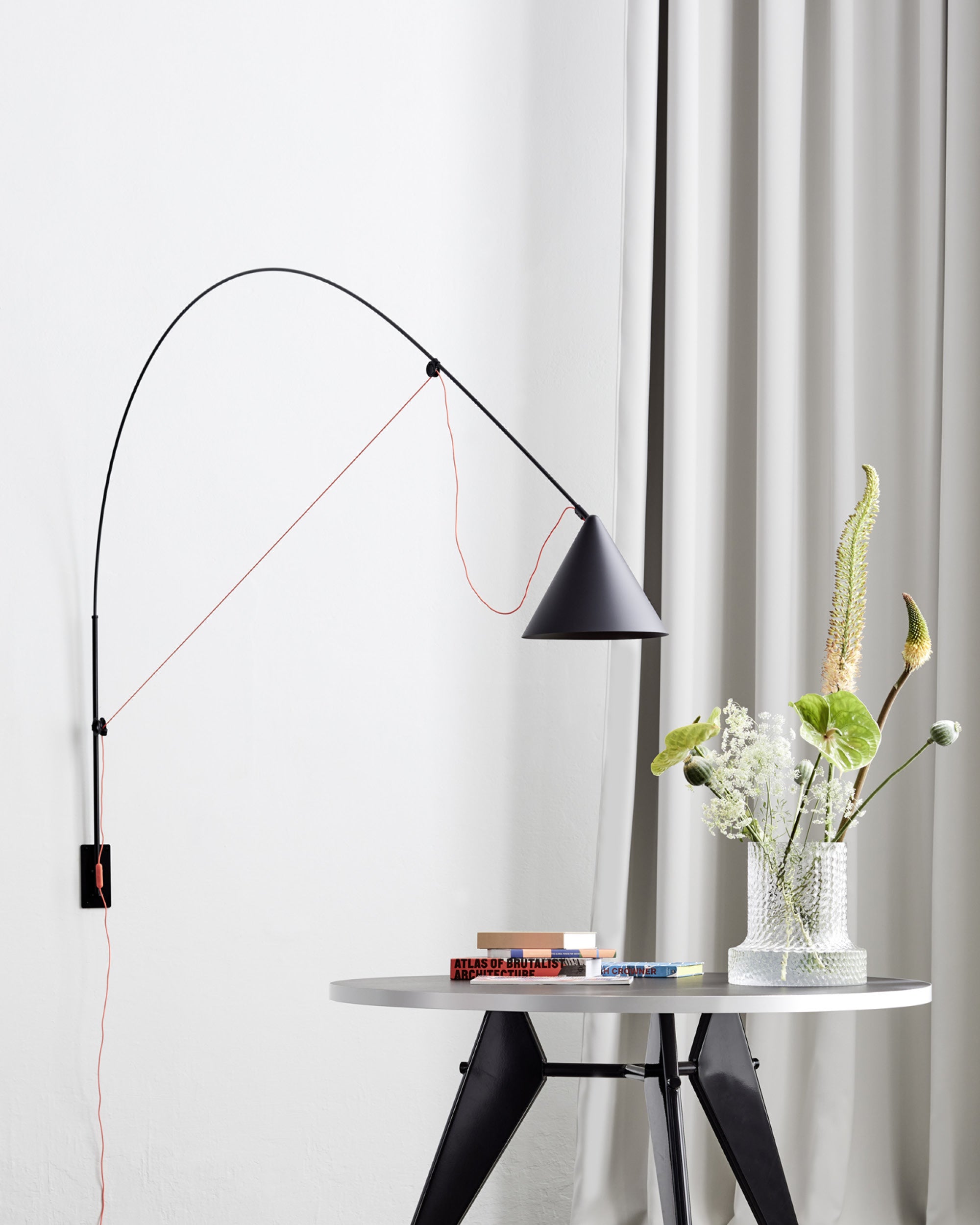 Midgard AYNO XL adjustable wall lamp in black in a modern dining interior
