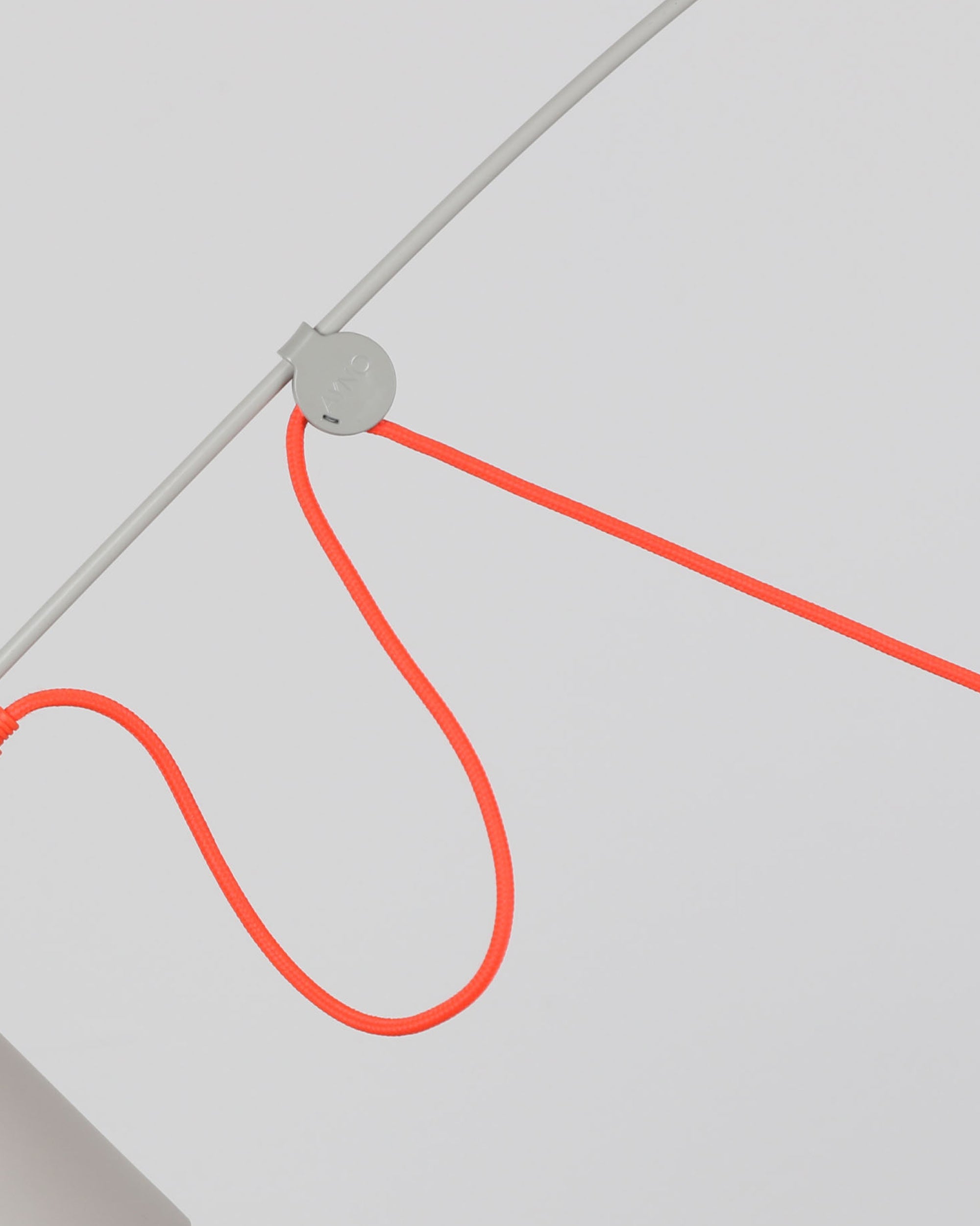Midgard AYNO XL adjustable wall lamp in silk grey, detail with neon orange textile cable