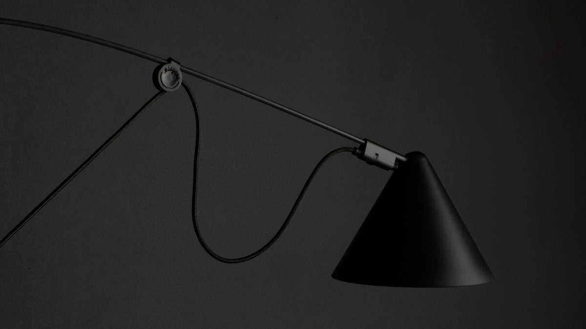 AYNO adjustable lamp by Stefan Diez for Midgard, showing its flexible fibreglass rod and movable lampshade