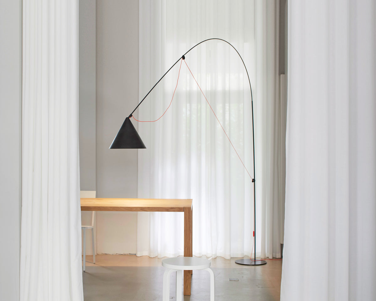 AYNO XL floor lamp designed by Stefan Diez for Midgard, providing extended reach and adjustable architectural lighting through its patented construction.