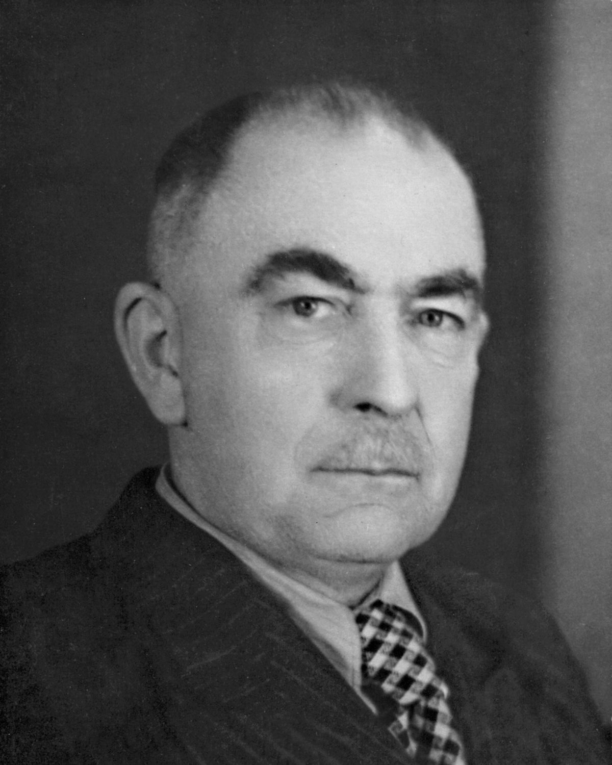 Portrait of Curt Fischer, founder of Midgard and inventor of the world's first patented adjustable electric lamp, whose designs included the TYP 113 Bauhaus lamp