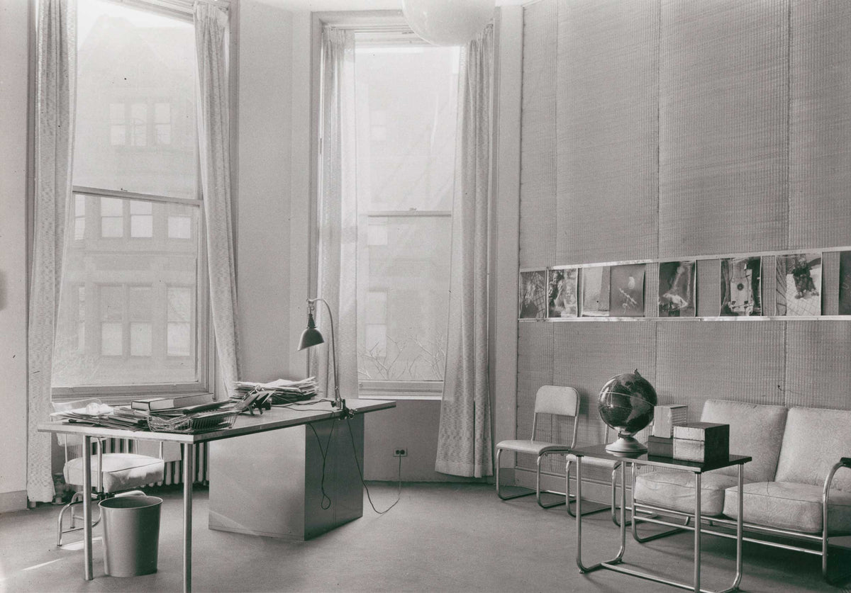Historic photograph of the Midgard TYP 113 Bauhaus task lamp in László Moholy-Nagy's director's office at the New Bauhaus Chicago in 1938, documenting the international influence of Midgard lighting beyond the original Bauhaus.