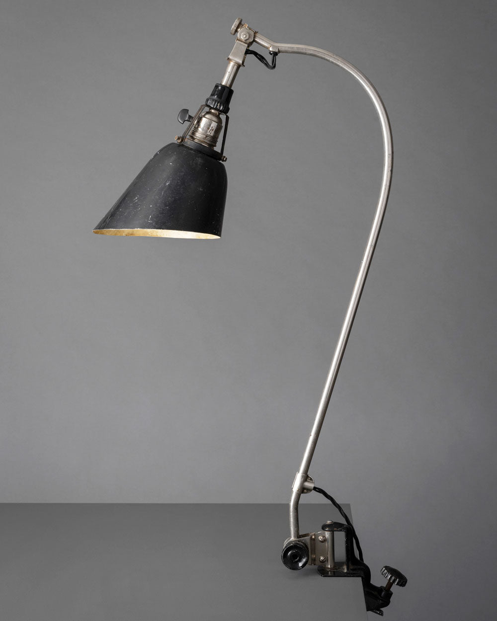 Original Midgard TYP 113  task lamp from 1930 with its characteristic flexible steel arm and adjustable metal lampshade, representing one of the earliest adjustable task lamps of the modern movement. Designed by Curt Fischer - inventor of adjustable lighting.