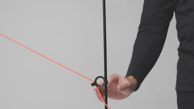 Close-up of the AYNO adjustable luminaire designed by Stefan Diez for Midgard, showing how the adjustment rings control the flexible fiberglass rod and position the light.