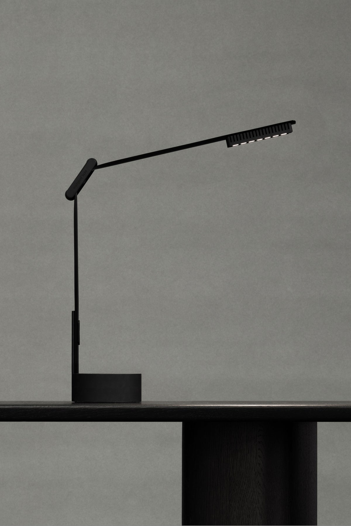 RAY by Midgard portable table lamp in black with adjustable light arm